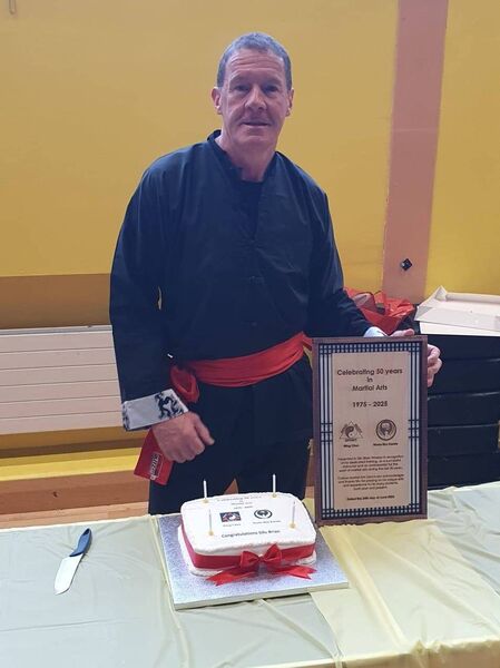 Sifu Brian Whelan with the plaque honouring his 50 years in the martial arts