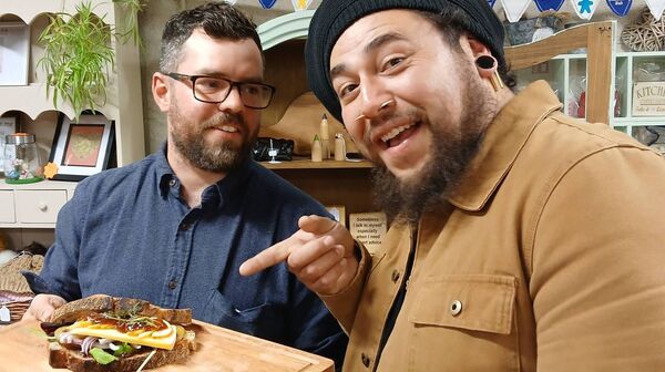 Peter Lee and Mikael Galvez delight at the #FirstNameFood sandwich made at the Tinryland Hub that evening with local produce