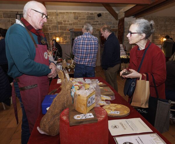 Tom Burgess (Coolatin Cheddar) chats with Jenny Street at the Lisnavagh Christmas Market. Pic: © Michael O’Rourke Photography