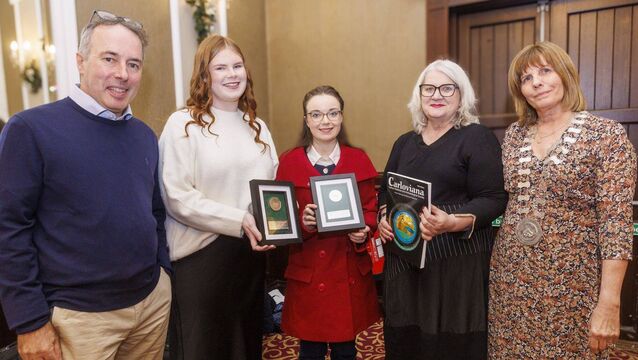 <p>Jill Kennedy-McGrath and Kayla White, winners of the third-level history prize, with Turtle Bunbury, historian, lecturer Ida Milne and president of the society, Helen Doyle</p>