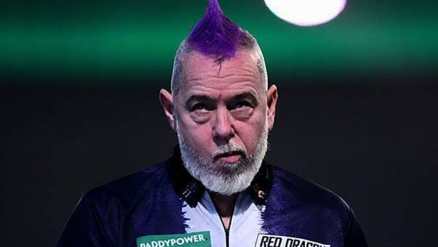Peter Wright crashes out in round two after predicting he would win title