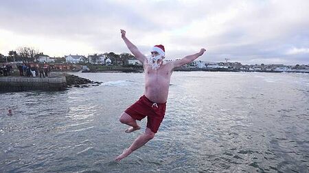 Crowds brave chilly temperatures for Christmas Day swim