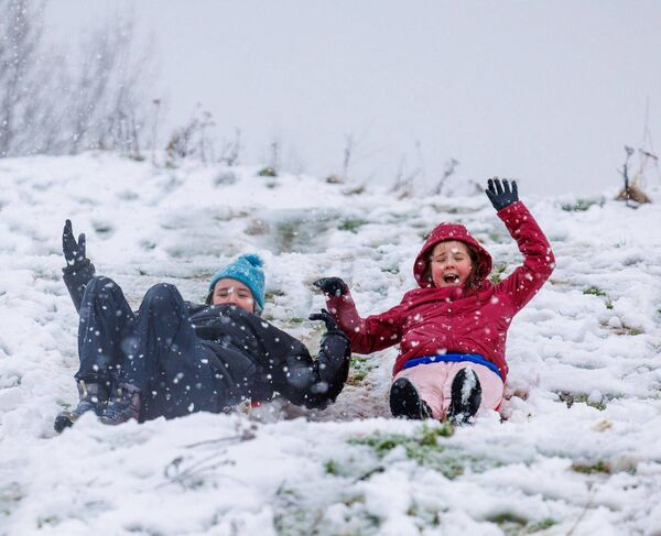 January: Hannah and Leah Dermody have fun sledding in the snow in Carlow Town Park January: Hannah and Leah Dermody have fun sledding in the snow in Carlow Town Park