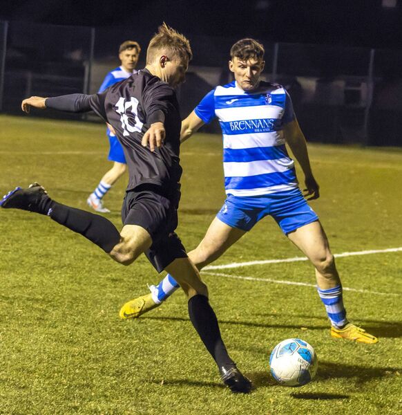 New Oak’s Sean Smithers looks to swing one in as St. Fiacc’s Aidan Bradley attempts to block the cross. New Oak’s Sean Smithers looks to swing one in as St. Fiacc’s Aidan Bradley attempts to block the cross.