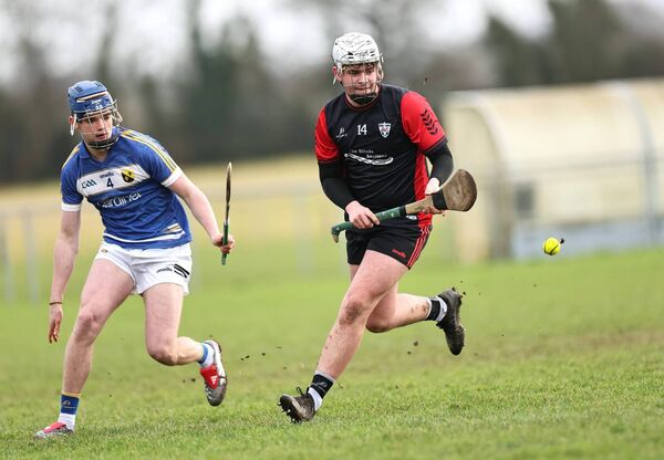 Cian O'Reilly (PDLS) gets ahead of Carnew's Conor Faulkner.