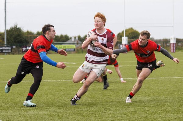 Tullow’s Dara Cosgrave evades the tackle of Tullamore’s Liam Farrell and Sean McCabe. All Photos: Michael O'Rourke Photography Tullow’s Dara Cosgrave evades the tackle of Tullamore’s Liam Farrell and Sean McCabe. All Photos: Michael O'Rourke Photography