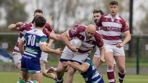 <p>Tullow's Stephen Smith charges at the Suttonians defence.</p>