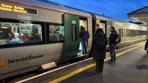 <p>Early morning commuters boarding a train at Carlow train station last week </p>