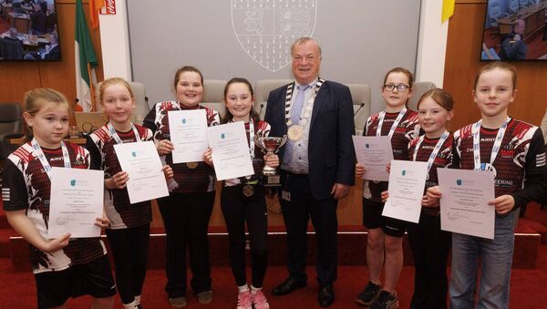 Cllr Ken Murnane with members of the Slaney Valley U10 indoor soccer team