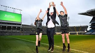 <p>GAA president Jarlath Burns with Isabelle O'Meara and Cillian O'Hanlon of O'Tooles GAA Club at Croke Park for the announcement of the extension of John West's sponsorship of Féile Photo: Sam Barnes/Sportsfile</p>