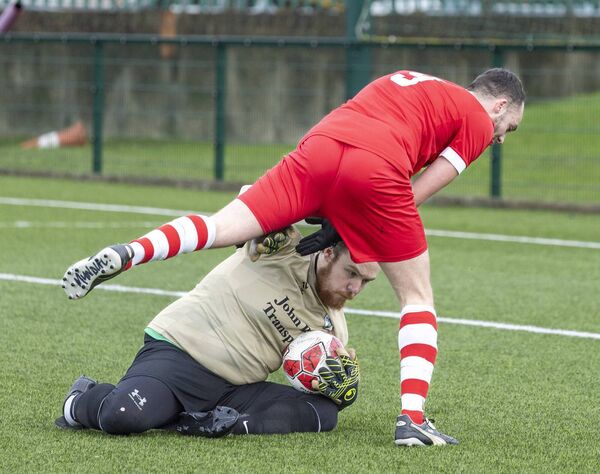 Mill Celtic ‘keeper Cody Dempsey gathers the all ahead of Castle Rangers Craig Bowden. Photo: michaelorourkephotography.ie Mill Celtic ‘keeper Cody Dempsey gathers the all ahead of Castle Rangers Craig Bowden. Photo: michaelorourkephotography.ie