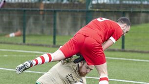 <p>Mill Celtic ‘keeper Cody Dempsey gathers the all ahead of Castle Rangers Craig Bowden. Photo: michaelorourkephotography.ie</p>