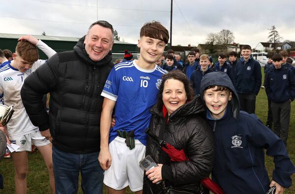 Knockbeg joint captain Cormac Murphy is congratulated by his parents Fergal and Fiona after their big win in the South Leinster 'A' football final.