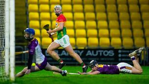 <p>Fiachra Fitzpatrick scores a first half goal during Carlow's defeat to Wexford last Saturday evening Photo: ©INPHO/James Lawlor</p>