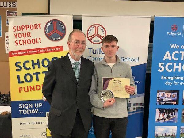 Jamie Noctor is presented with the Merit Boy of the Year Award by former principal Christopher McQuinn 