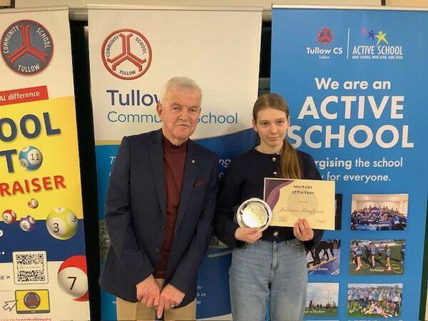 Former deputy principal Timothy Moriarty presenting Julianna Timofejeva with the Merit of the Year Girl Award