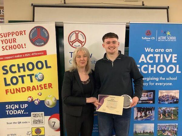 Ben Shannon is presented with the Spirit of the Community Award by Eimear Fitzgerald 