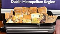 Woman (30s) arrested after gardaí seize €275,000 in cash