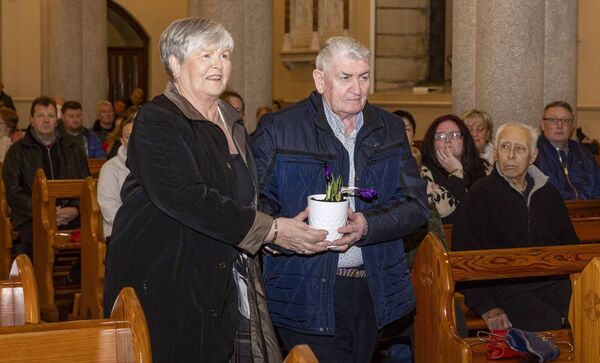 Josie and Pat Hennessy on the day of their 50th wedding anniversary bring a gift to the altar Josie and Pat Hennessy on the day of their 50th wedding anniversary bring a gift to the altar