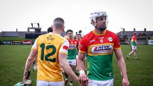 <p>Antrim's Ruairi Donaghy shakes hands with Kevin McDonald of Carlow after the game Photo: ©INPHO/Dan Clohessy</p>