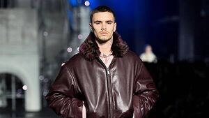 Romeo Beckham and Rosie Huntington-Whiteley on catwalk at London Fashion Week