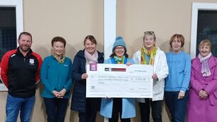 <p>Members of Clonegal Kildavin GAA gave a donation of €750 to Kildavin NS principal, Gillian Murphy</p>
