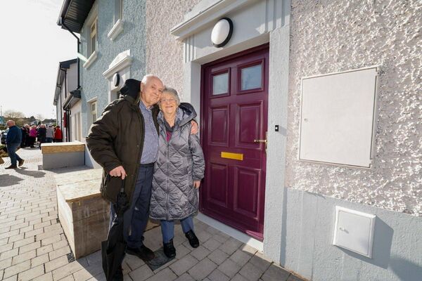 Denise and Hugh O'Rourke outside Denise's former home on Barrack Street, at the unveiling of eight new social homes by Carlow County Council. Photo: Michael O'Rourke Photography 2026.