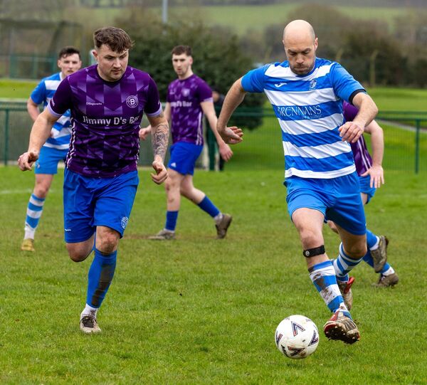 Bagenalstown’s Padraig Hynes chases down St. Fiacc’s' Robert Dowling. Photo: Michael O'Rourke.
