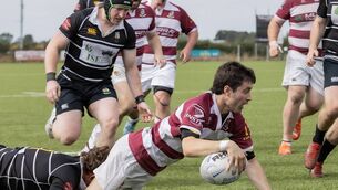 <p>Tullow's Ryan O'Neill crosses over for Tullow's first try despite the leg tackle from Kilkenny's Harry Prineas.</p>