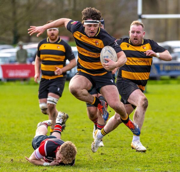 Carlow flanker Dave McDermott avoids being tackled Wicklow’s Finn Fitzpatrick in Carlow's impressive Towns Cup victory on Sunday.
