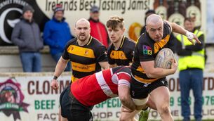 <p>Carlow’s Dan Gray is tackled by Wicklow’s Max Richards in the Leinster Towns Cup Last 16 at Oak Park. Photo: Michael O'Rourke.</p>