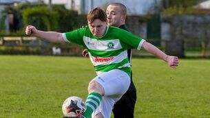<p>Burrin Celtic’s Ryan Clarke clears ahead and Hanover’s Liam Ryan during their Nationalist Premier Division clash Photo: Michael O'Rourke </p>