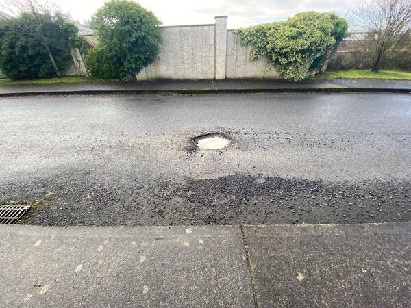 One of the large potholes that continue to plague The Friary housing estate