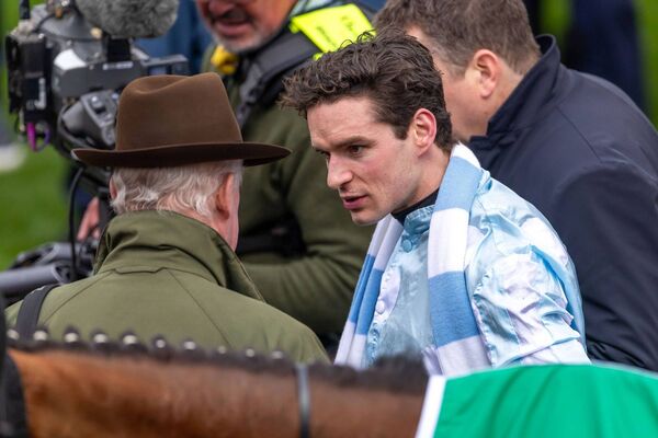 Danny Mullins and Willie Mullins share a word after the race. Photo: INPHO/Morgan Treacy