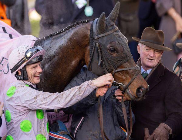 Paul Townend and Willie Mullins celebrate with Gaelic Warrior after winning the Cheltenham Gold Cup. Photo: INPHO/Morgan Treacy
