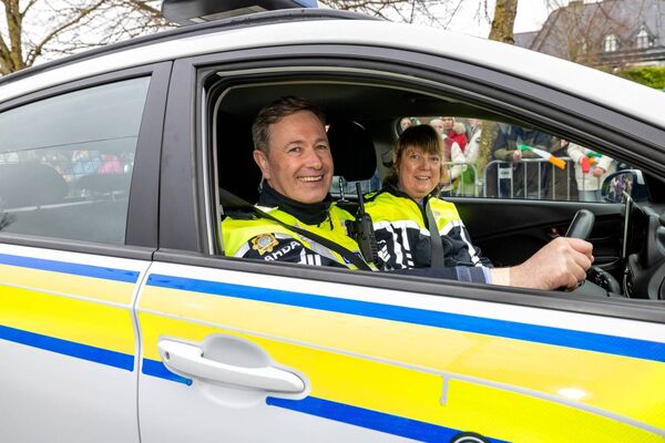 Sgt Conor Egan pictured with Sgt Fiona Fitzpatrick on his last St. Patrick’s Day Parade before he retires. Pic: © Michael O'Rourke Photography 2026