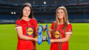 <p>St. Leo's College Lucie O'Reilly and and Emma Malone with the All-Ireland trophy at Croke Park Photo: Tyler Miller/Sportsfile </p>