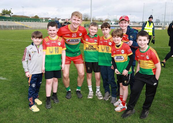Ross Dunphy is congratulated on Carlow's promotion by some young fans