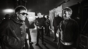 Liam and Noel Gallagher shown having a laugh in Oasis tour photography book