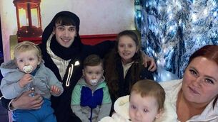 <p>Jayden and Nevaeh O'Neill (centre), who fell from a second-floor balcony in Waterford on Friday, with father Ryan O'Neill and mother Regina Smith, and siblings Jaxson (far left) and Alliyah (far right) Photograph courtesy of Regina Smith</p>
