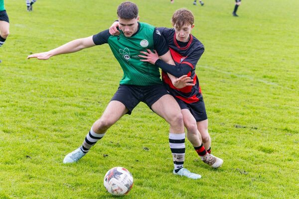 Hanover’s Conor Harte holds off Parkville’s Niall O’Byrne. Hanover’s Conor Harte holds off Parkville’s Niall O’Byrne.