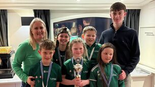 <p>Bennekerry/ Tinryland U12 draughts team were 2nd in a four-way European tournament in Koudum, Netherlands last November. (Back left to right) Sara Donegan, Kenny Bolger; (Front) Cian Bolger, Seoidín Breen, Darcy Donegan. With coaches Mairéad and Páidí Breen</p>