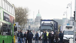Police in Belfast attacked with petrol and paint bombs