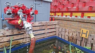 <p>Old fire engine fire pump, now mounted as a water feature using a solar pump</p>