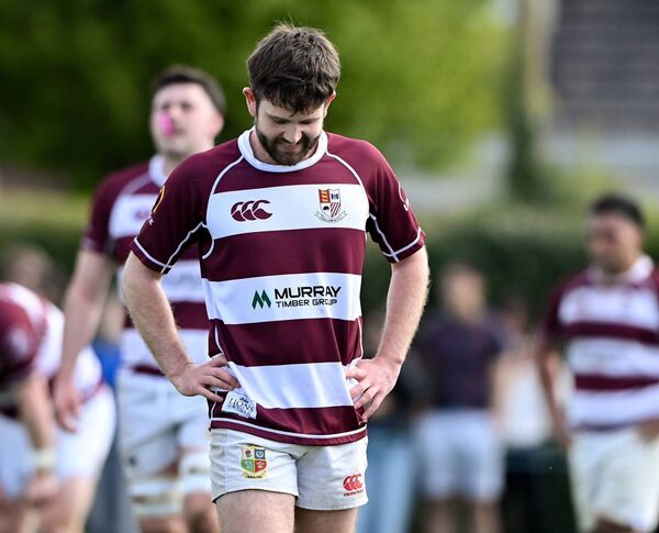 Tullow scrum half Cian Leonard hangs his head as Athy run in another first-half try. 