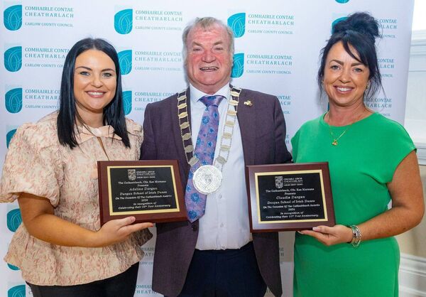 Claudia and Adeline Dargan from the Dargan School of Irish Dance receive their awards from cathaoirleach Ken Murnane