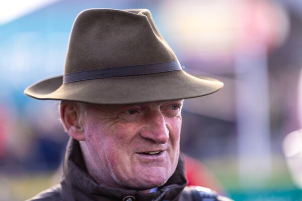 Trainer Willie Mullins celebrates a treble on the opening day of the Punchestown festival.