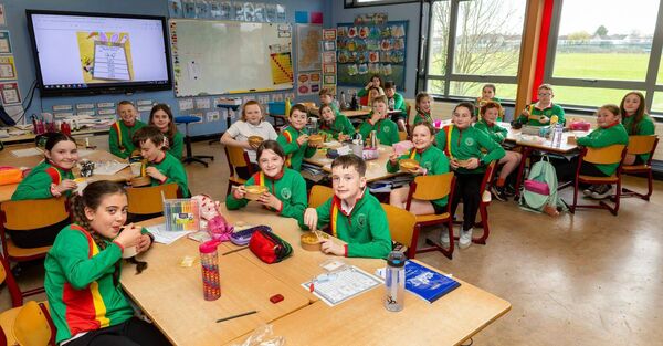 Fourth class pupils enjoying their hot lunches 