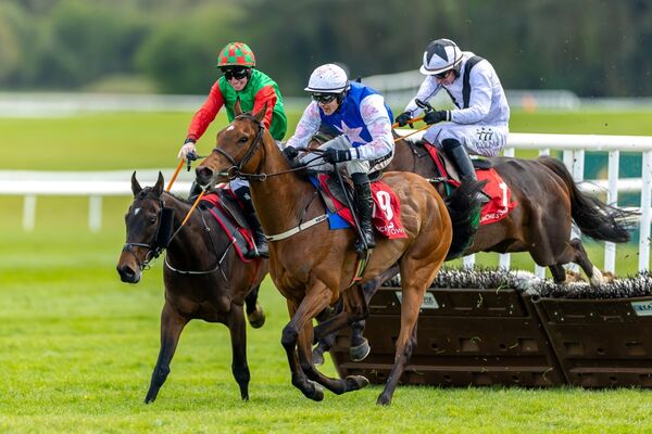 Danny Mullins on Beauvallon holds off the challenge from Jack Kennedy on Immediate Effect to win The Specialist Group Novice Hurdle