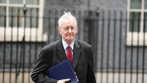 Man arrested over footage appearing to show shots being fired over a coffin